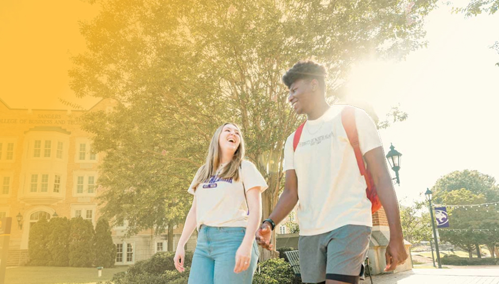 smiling students walking on campus