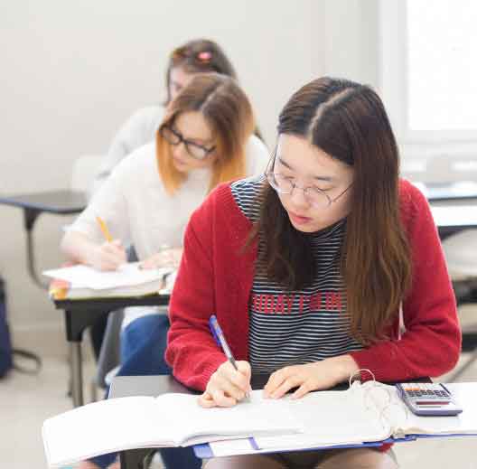students in class taking notes