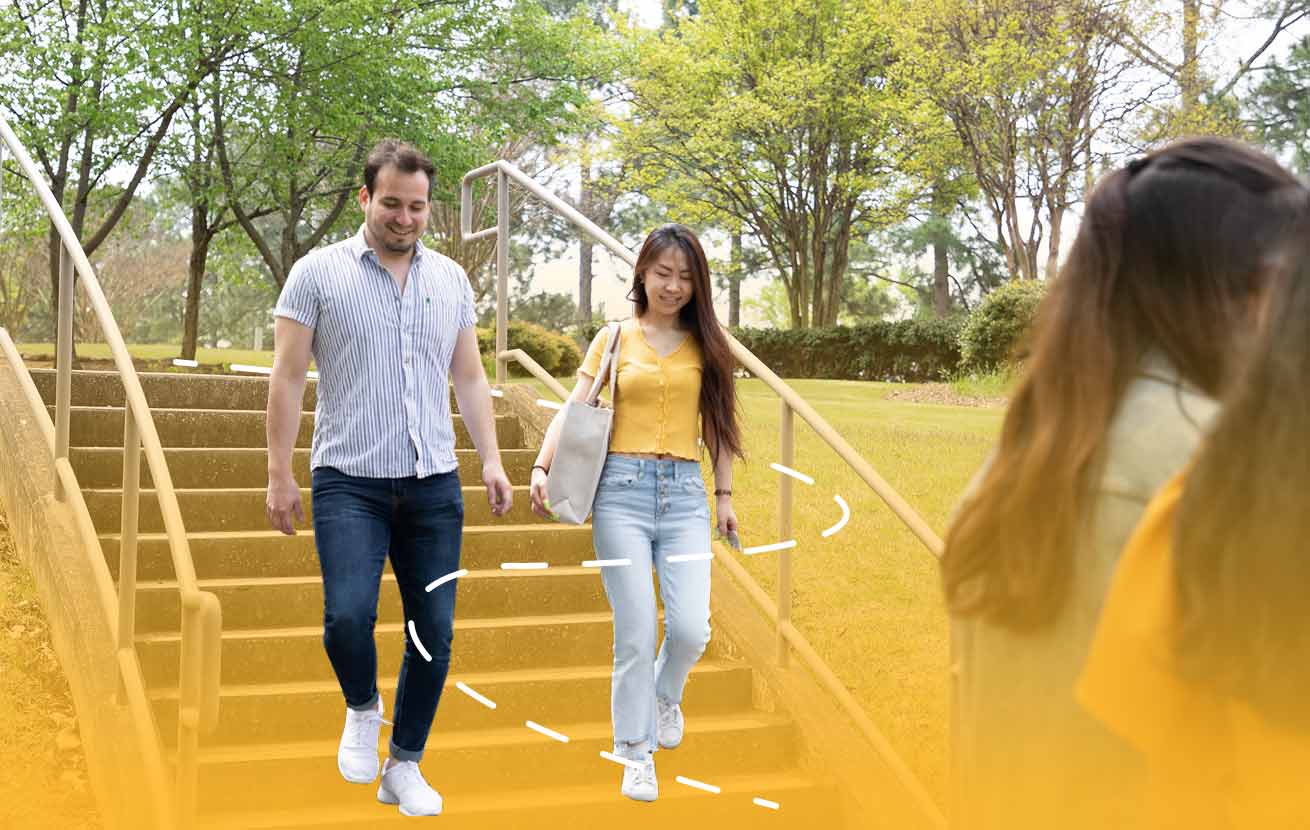students walking down steps on campus