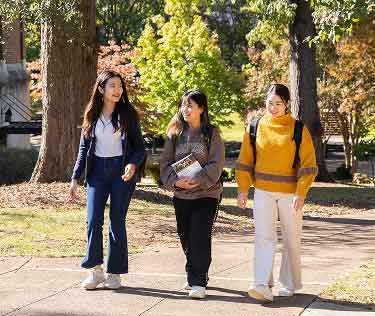 students walking on campus in autumn