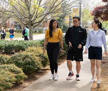 students walking on campus in autumn