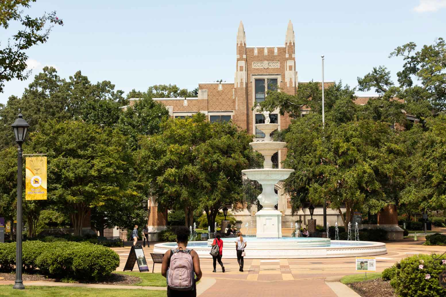 large brick building and beautiful fountain