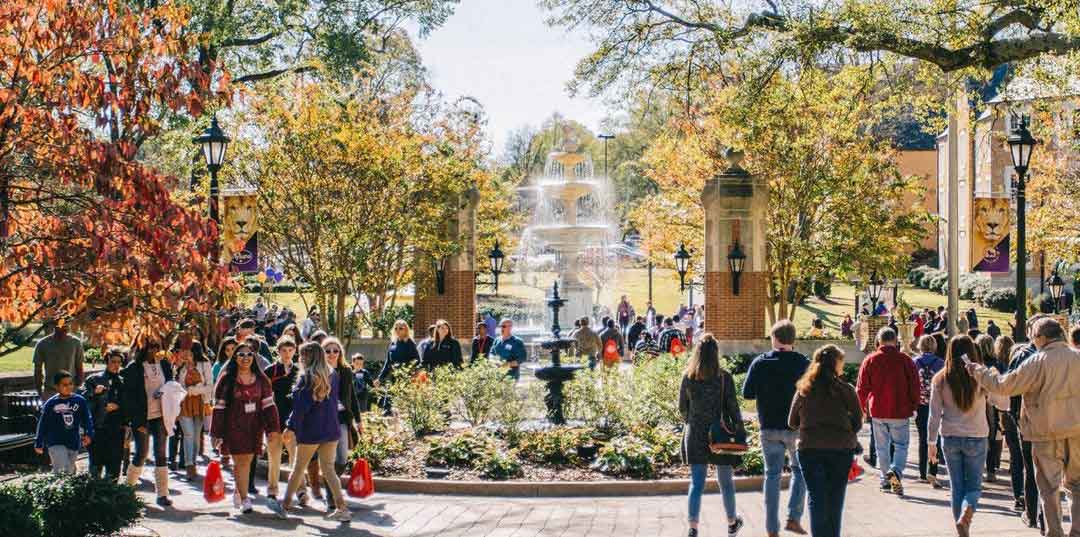 beautiful fountain on busy campus grounds